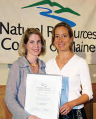 Elisa Boxer accepting award for legislation safeguarding health of Maine's children and families from toxic chemicals in consumer products